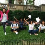 People doing yoga poses during New York Midtown Scavenger Hunt.