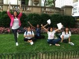 People doing yoga poses during New York Midtown Scavenger Hunt.