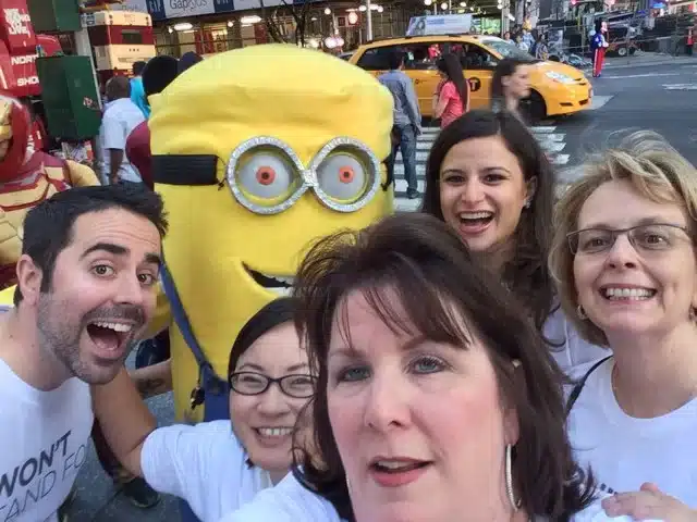 Corporate team gets a selfie with a minion during their scavenger hunt.