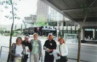 Scavenger hunt team in front of a locmotive in downtown Calgary.