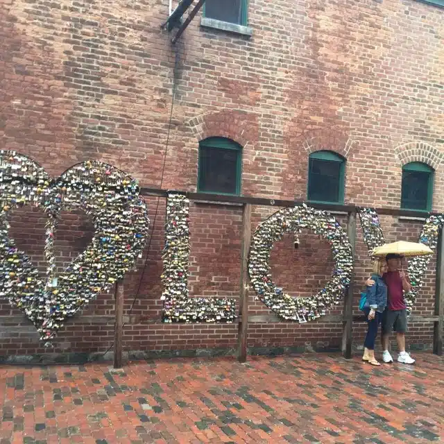 Team gets a photo by the love sign in Toronto's Distillery District.
