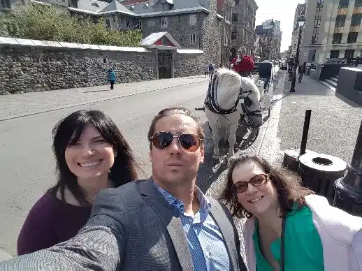 Scavenger Hunt Team takes a photo with a horse in Old Montreal