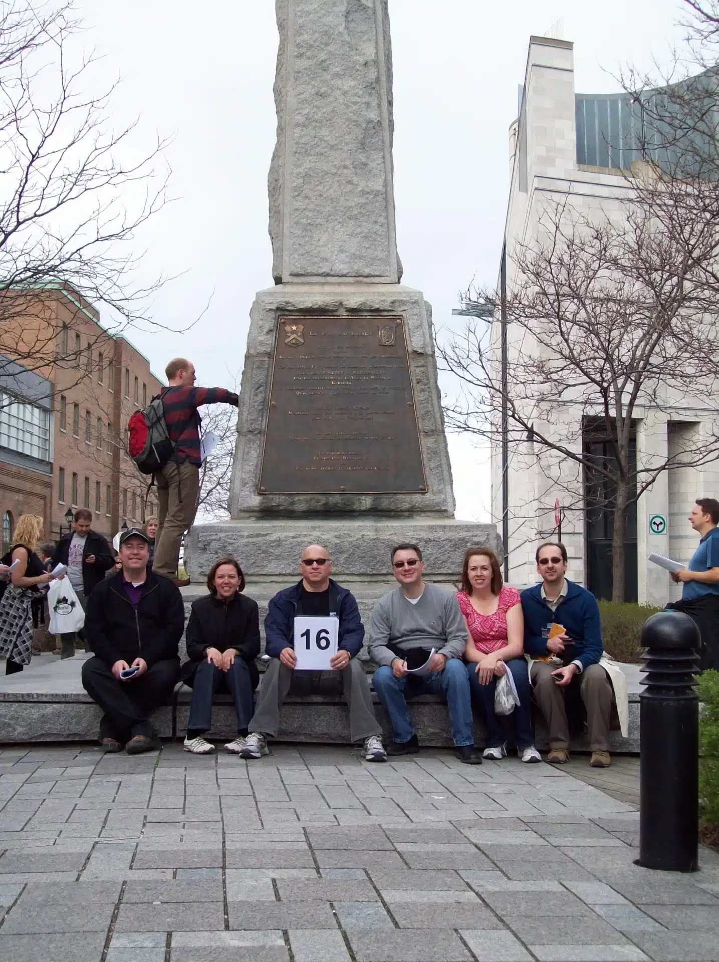 Six people in front of a monument in Old Montreal