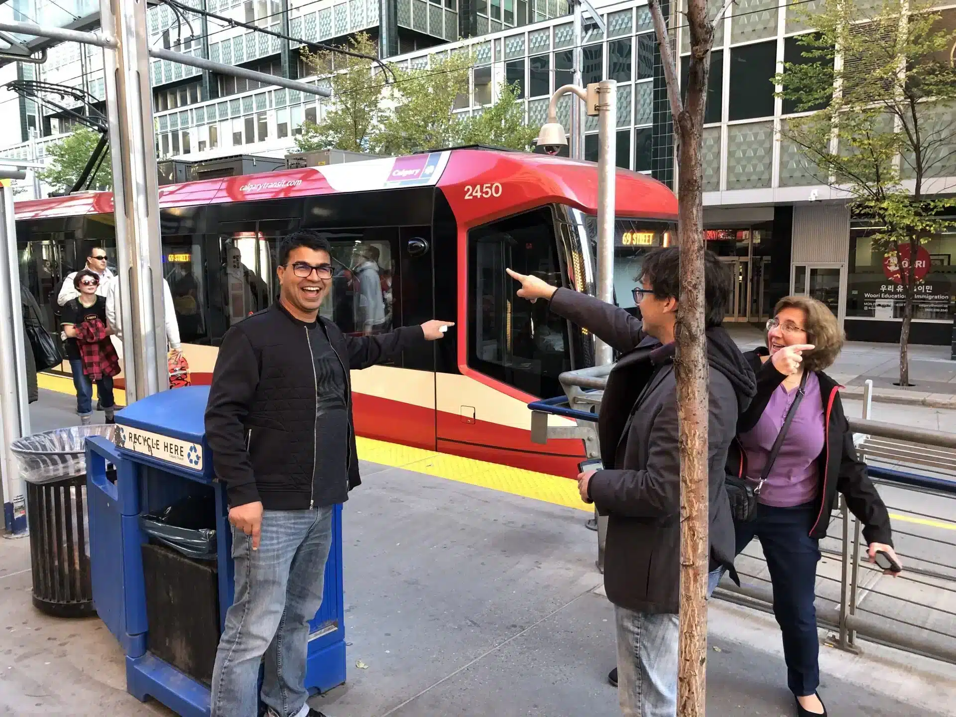 Corporate team points out the C-train in their Calgary Scavenger Hunt