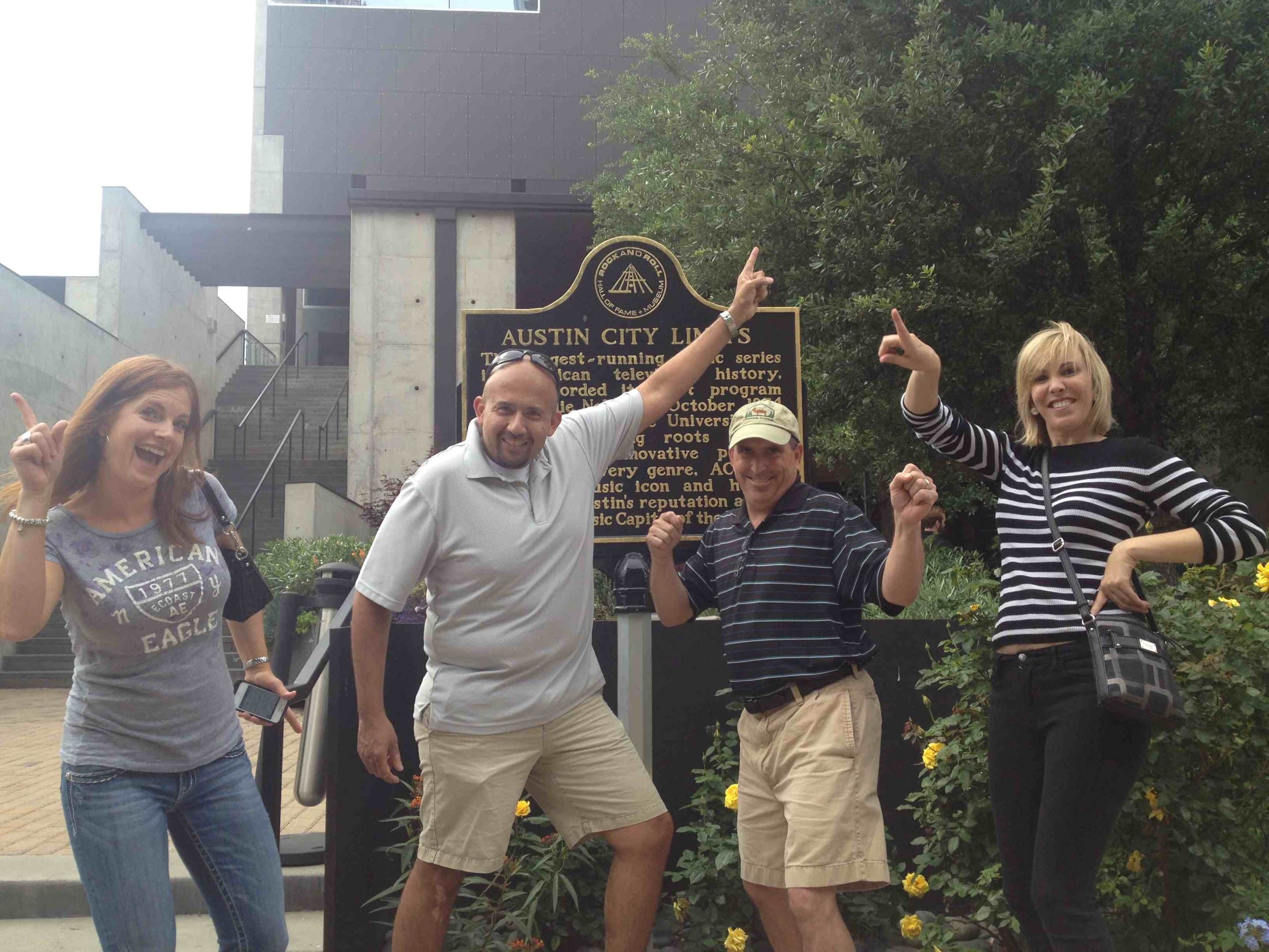 Austin-scavenger-hunt-12 Scavenger Hunt team dancing at the Austin City Limits historical plaque.