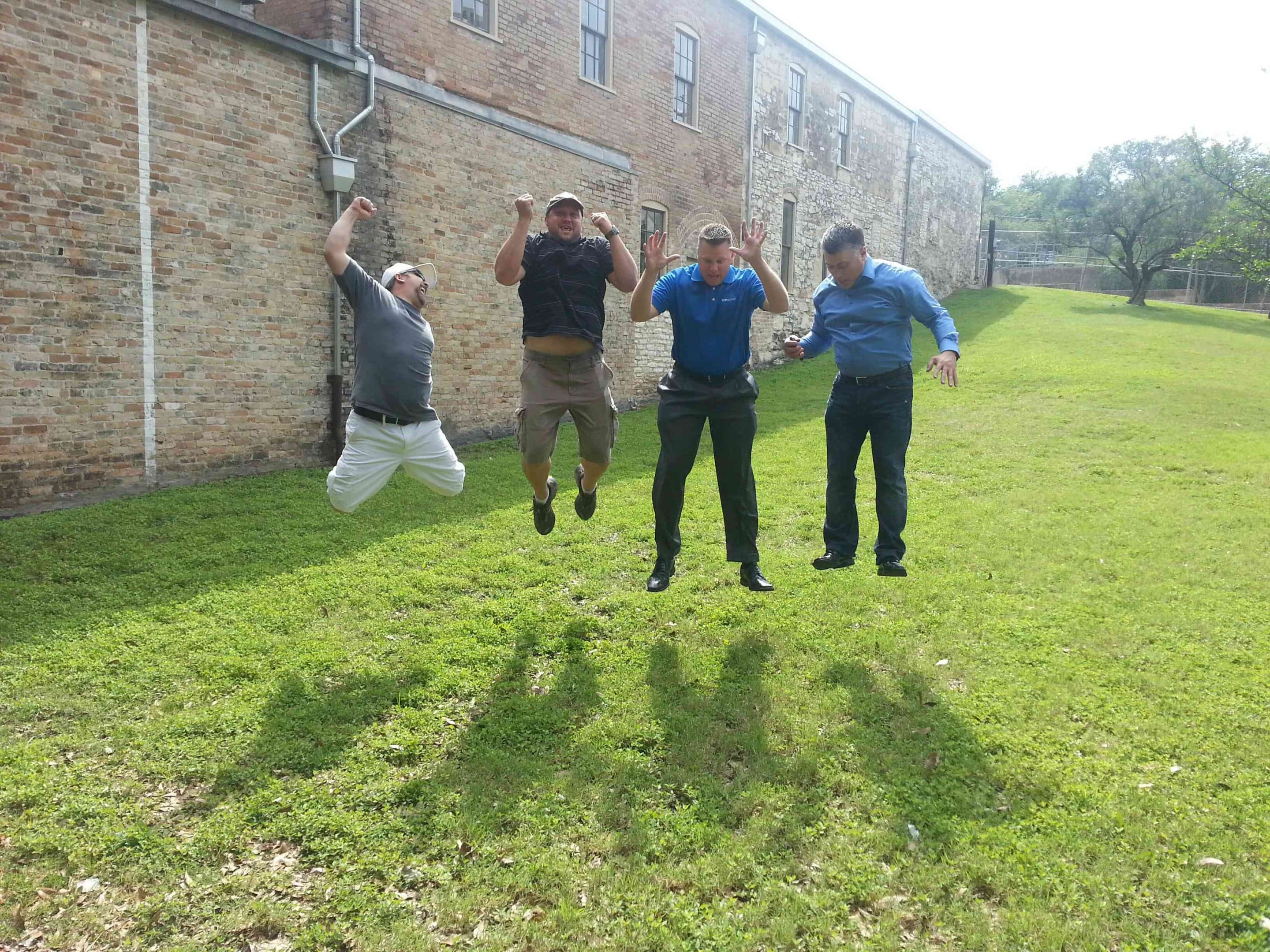 Four men jumping