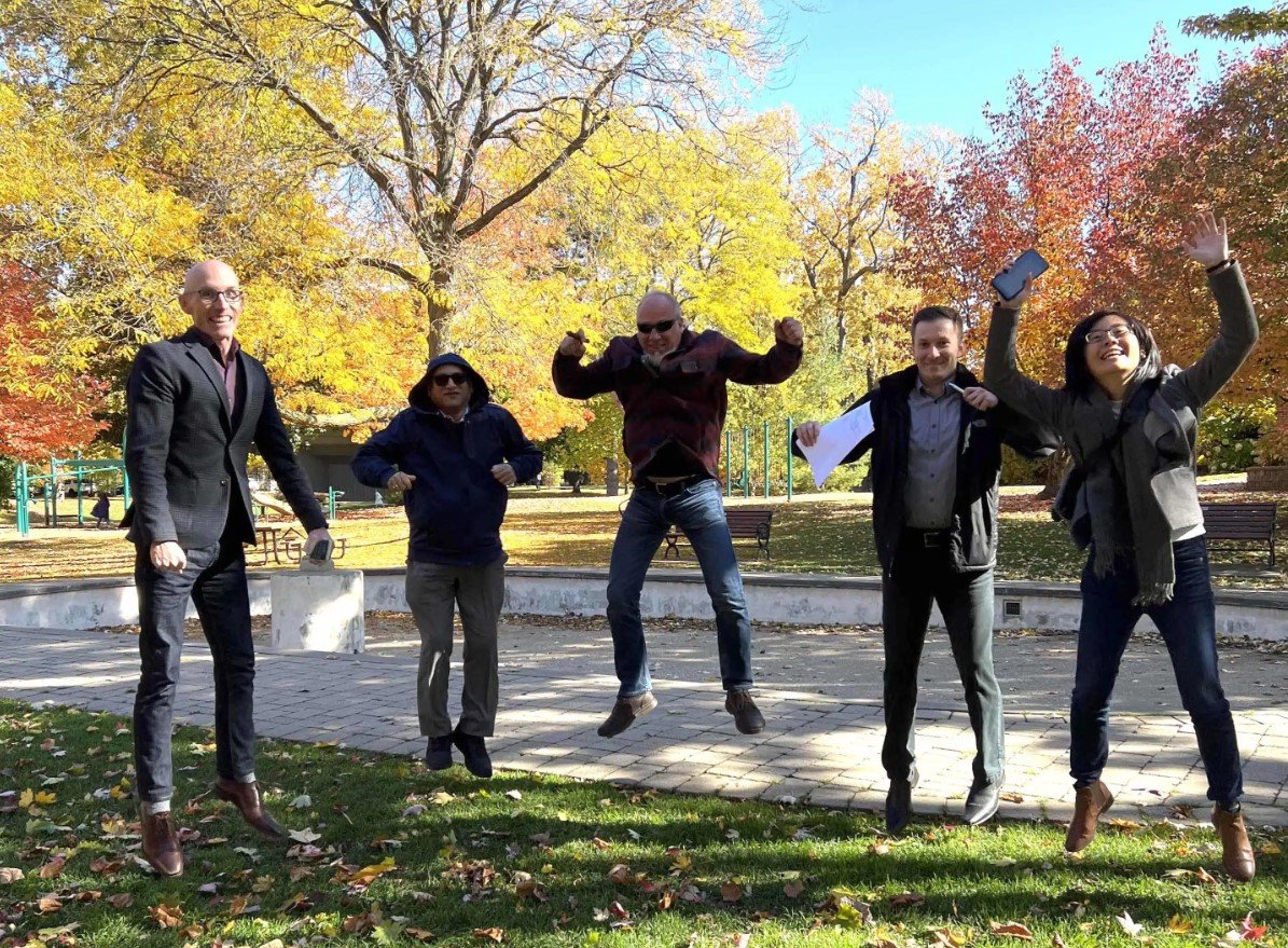 5 scavenger hunt participants jumping in the air