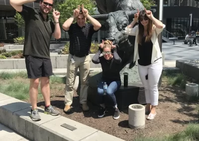 Corporate group with bull pose in Calgary hunt
