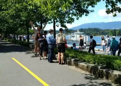A scavenger hunt team looking at a beautiful lake.