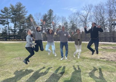6 team members jumping during the Foxwoods Scavenger Hunt.