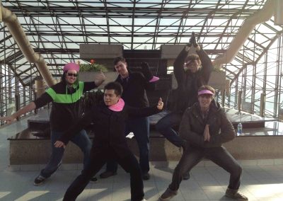 Scavenger hunt team members doing a Kungfu stance during a team building activity in Edmonton.