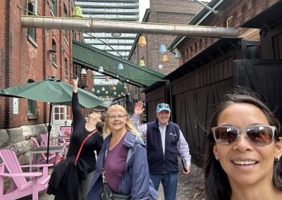 Scavenger hunt team members taking a selfie in an ally