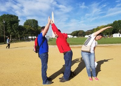 A scavenger hunt team spelling out DC with their bodies.