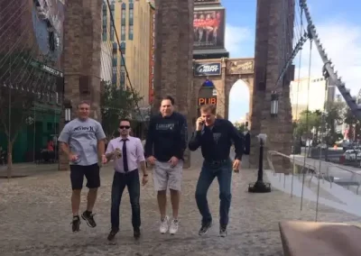 A team of four members jumping