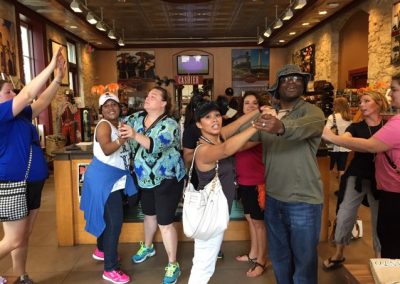 4 pair of people doing waltz dance during a team building activity in San Antonio.