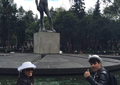Scavenger hunt team take a photo in front of a fountain