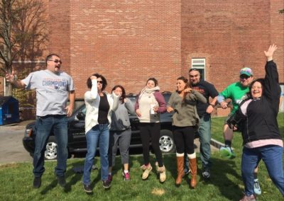 8 team members jumping during the Salem Scavenger Hunt.