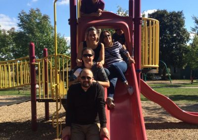 Scavenger hunt team members sliding down a slide in Waterloo.