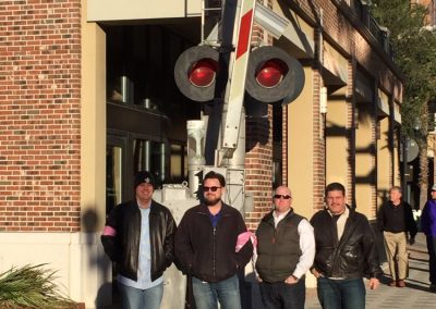 Scavenger hunt team members standing in front of a sign