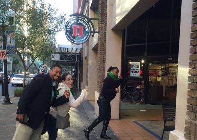 Teams running into a restaurant during a team building activity in downtown Orlando