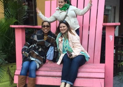 Scavenger hunt team members sit on a giant chair