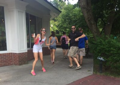 Scavenger Hunt team members running away from the camera.