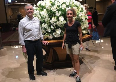 Scavenger hunt team takes photo with a large bouquet of flower