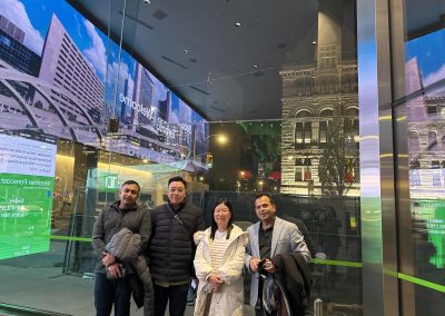 Scavenger hunt team stand in front of displays